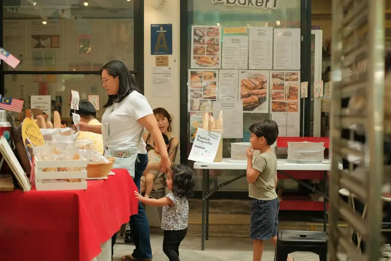 People working at a Malaysian bakery counter